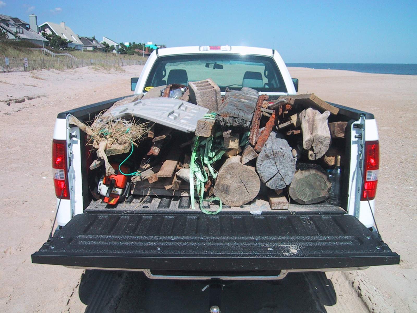 Beach debris loaded onto truck and ready for removal
